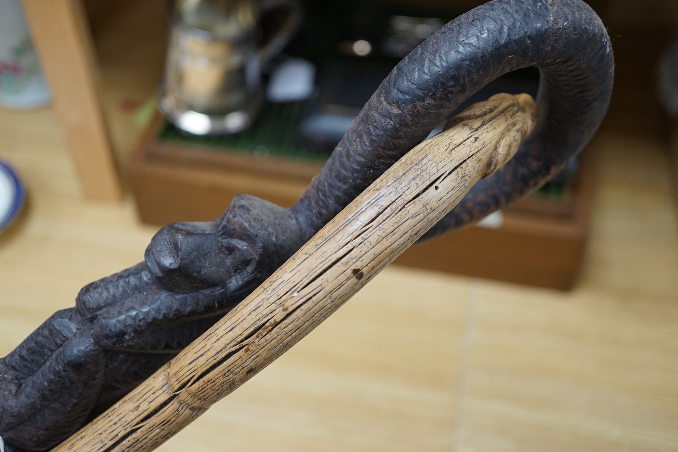 An African carved wood walking cane and a ‘dogs head’ walking cane